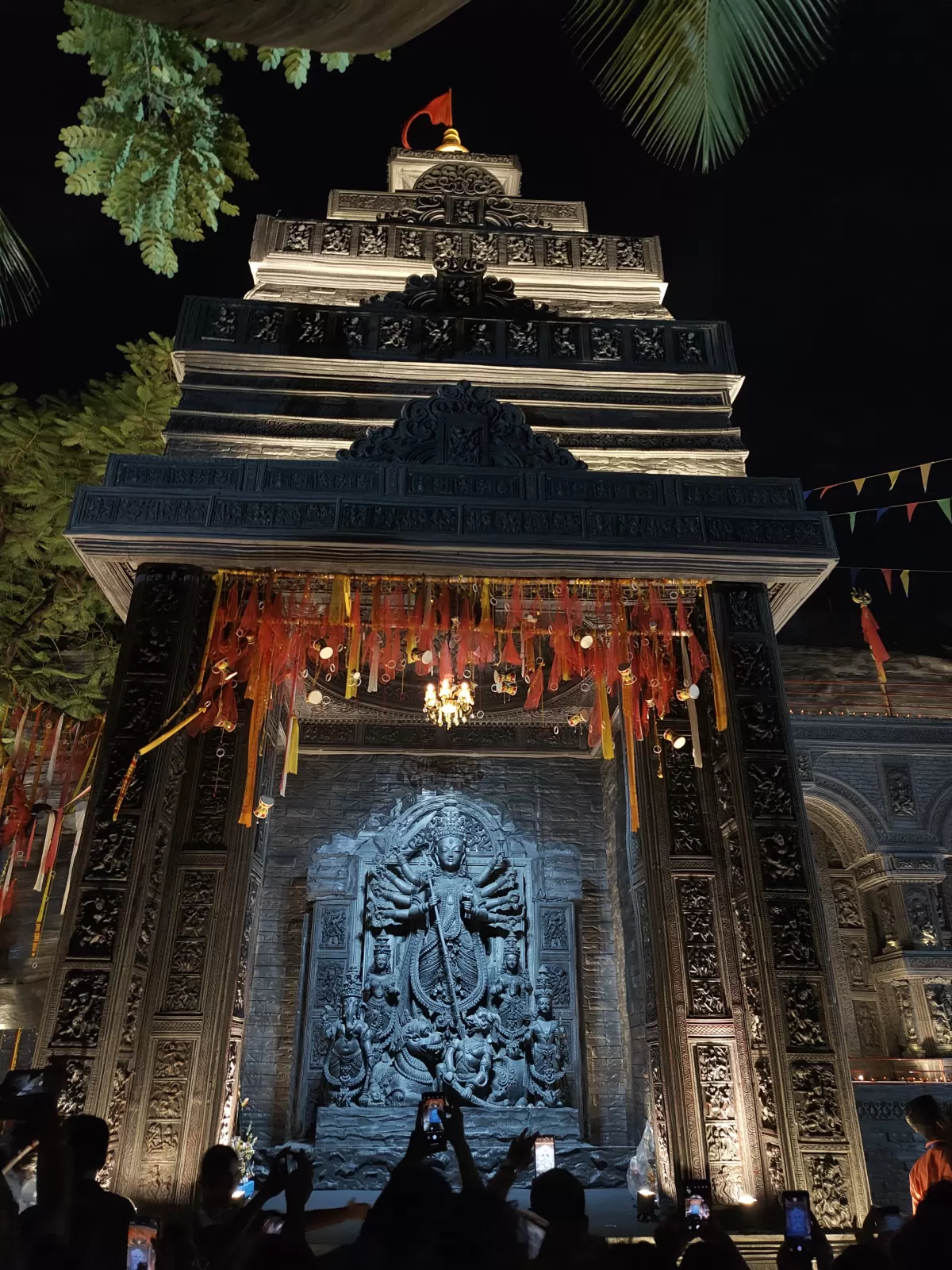 Visitors taking photos of Durga Puja pandal with mobile phones in Kolkata